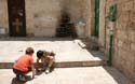 14 Israel, Jerusalem. Children playing--note Jesus and cross on door